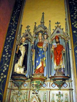 Au centre la Vierge, et à droite Saint-Eugène.